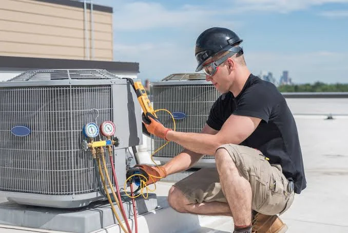 HVAC technician checking system readings with diagnostic instruments